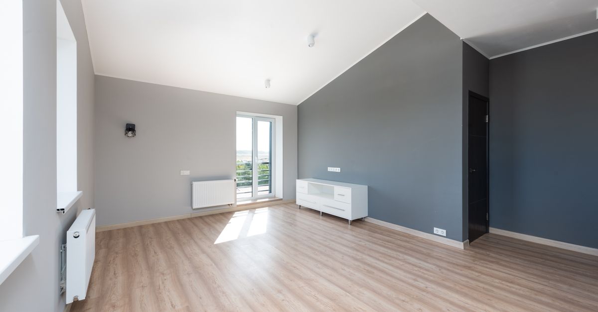 Modern apartment room with newly finished wood flooring