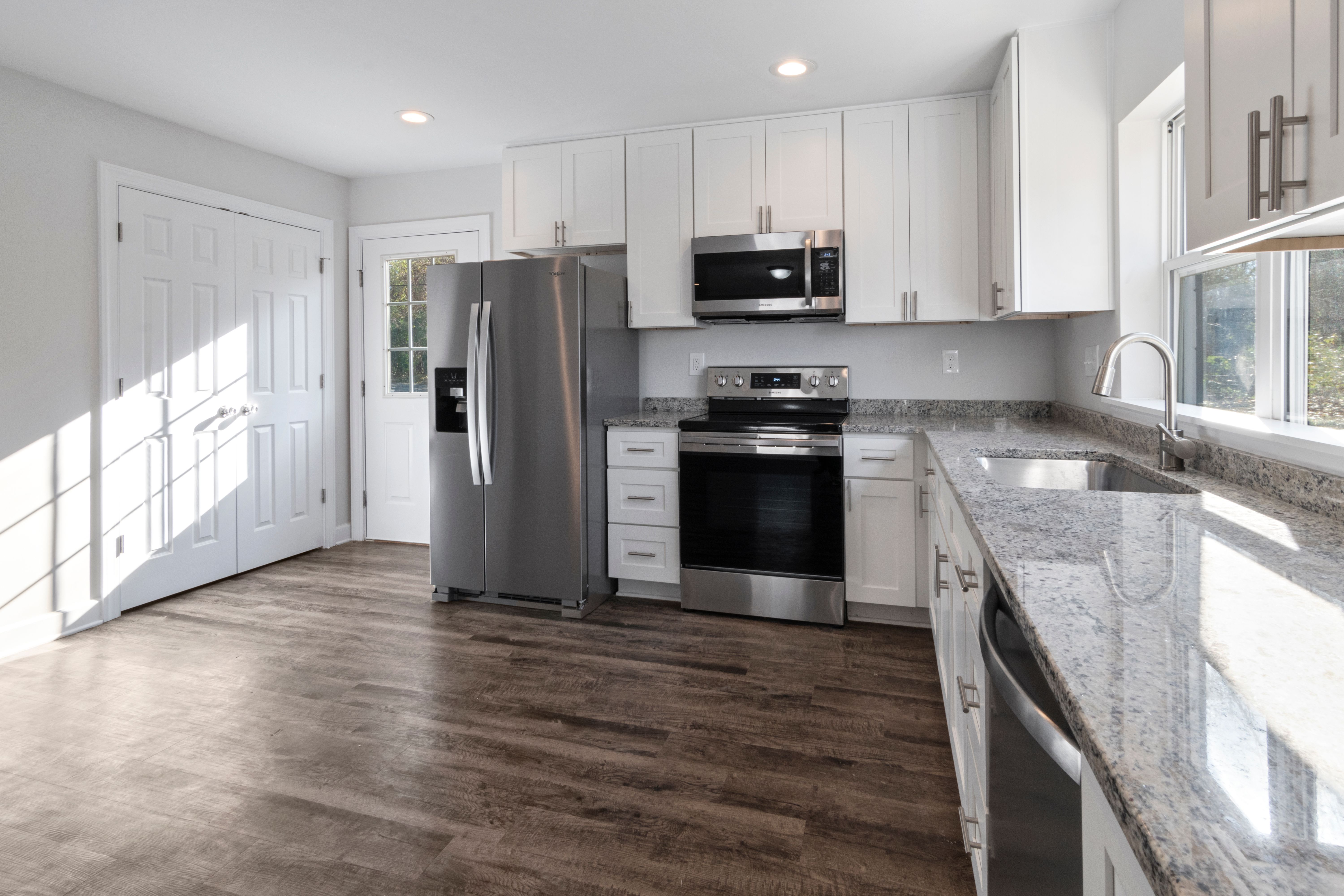 A stunning luxury kitchen renovation in Vancouver featuring custom millwork and a large island