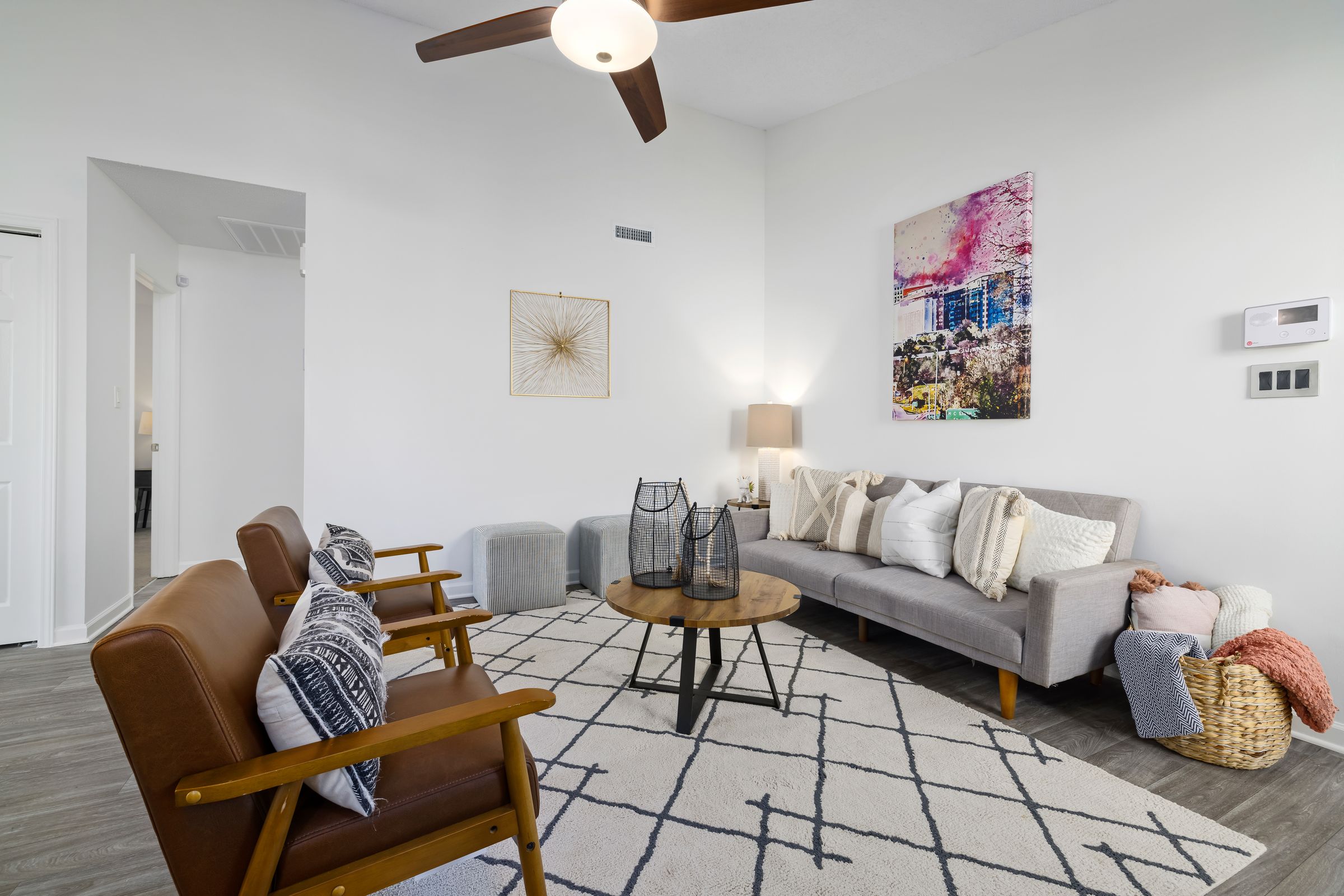Minimalist condo living room with wood-look luxury vinyl plank flooring in Toronto