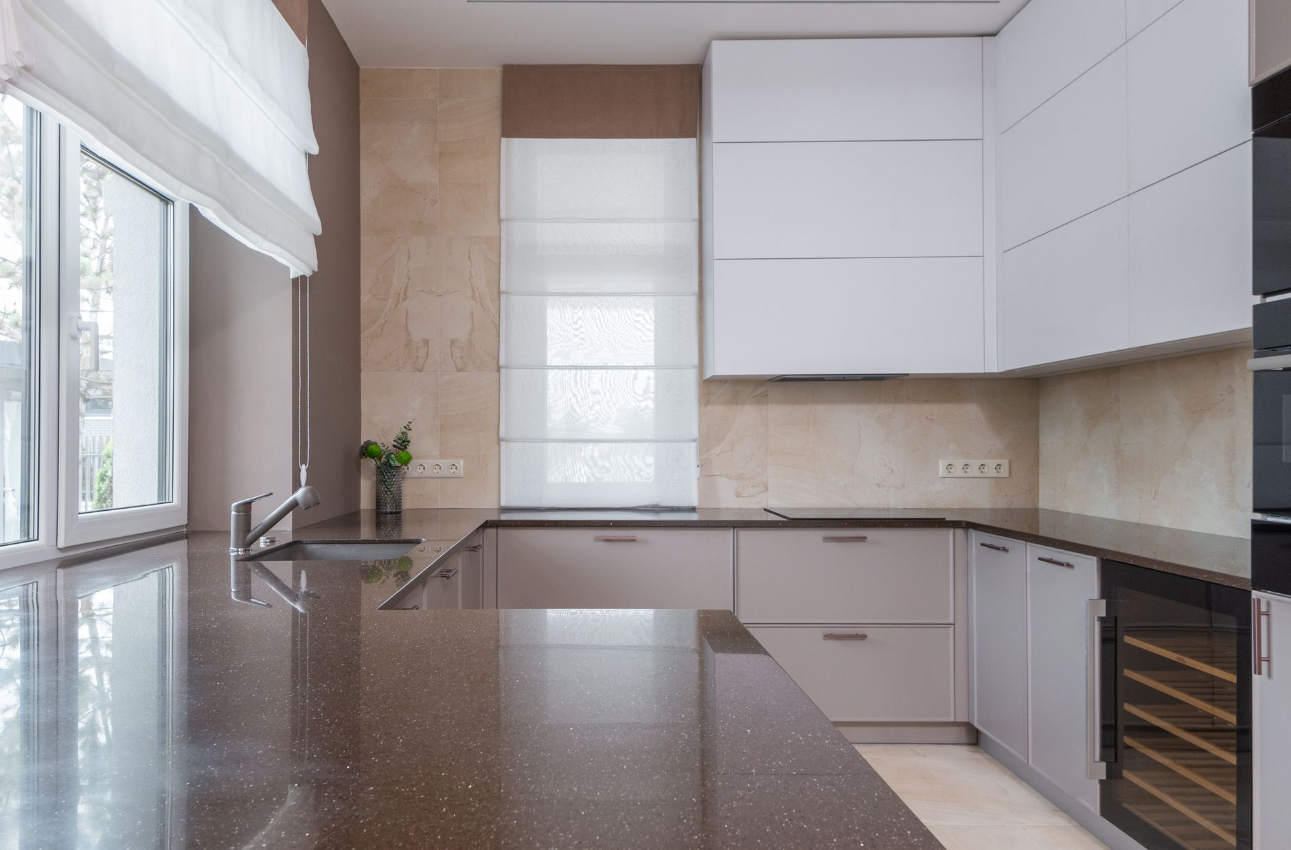Spacious modern kitchen under renovation with tools and ladders
